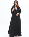 Black Floral Textured Blazer Abaya by Gharza Couture styled for modern modest fashion with a timeless tailored silhouette.