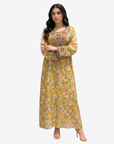 Luxury silk Mukhawar with a soft floral print, flowing full-length silhouette, and intricate hand embellishments on the neckline and cuffs.