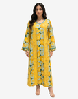 Golden Meadow Hand Embellished Cotton Jalabiya by Gharza Couture featuring a vibrant yellow floral print, handcrafted embellishment and elegant modest silhouette.