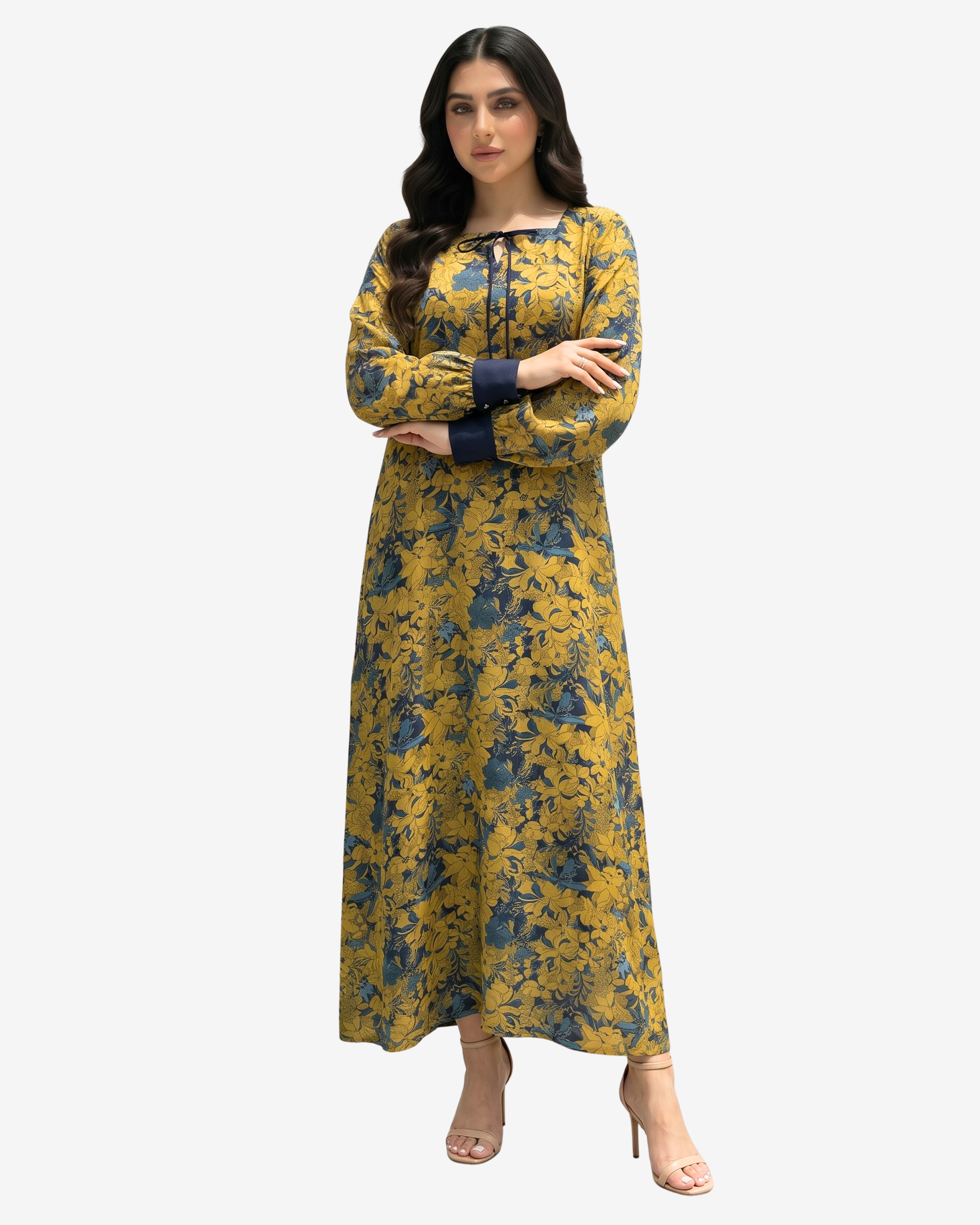 Luxury cotton chiffon dress with a flowing full-length silhouette, tie neckline, and elegant golden floral print.