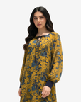 Close-up of the Golden Meadow Tie Neck Cotton Chiffon Dress highlighting the tie neckline, floral print, and lightweight chiffon fabric.