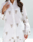 Close-up of the Golden Oasis Linen Blend Co-ord Set showcasing the button-down collar and elegant palm print