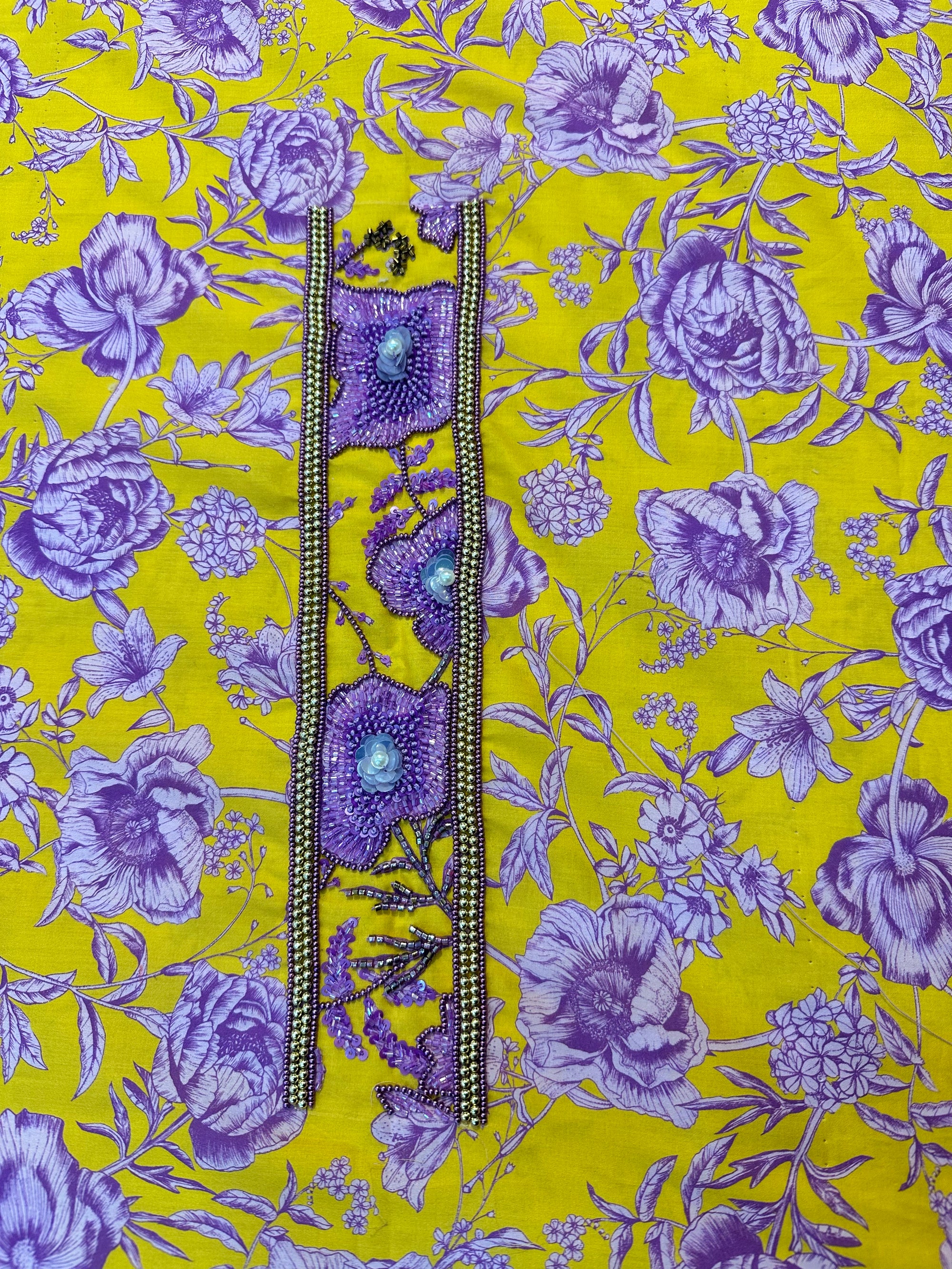 Premium Liberty cotton fabric displaying the golden yellow and violet floral print of the Golden Violet Liberty Cotton Mukhawar for custom tailoring by Gharza Couture.