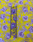 Premium Liberty cotton fabric displaying the golden yellow and violet floral print of the Golden Violet Liberty Cotton Mukhawar for custom tailoring by Gharza Couture.