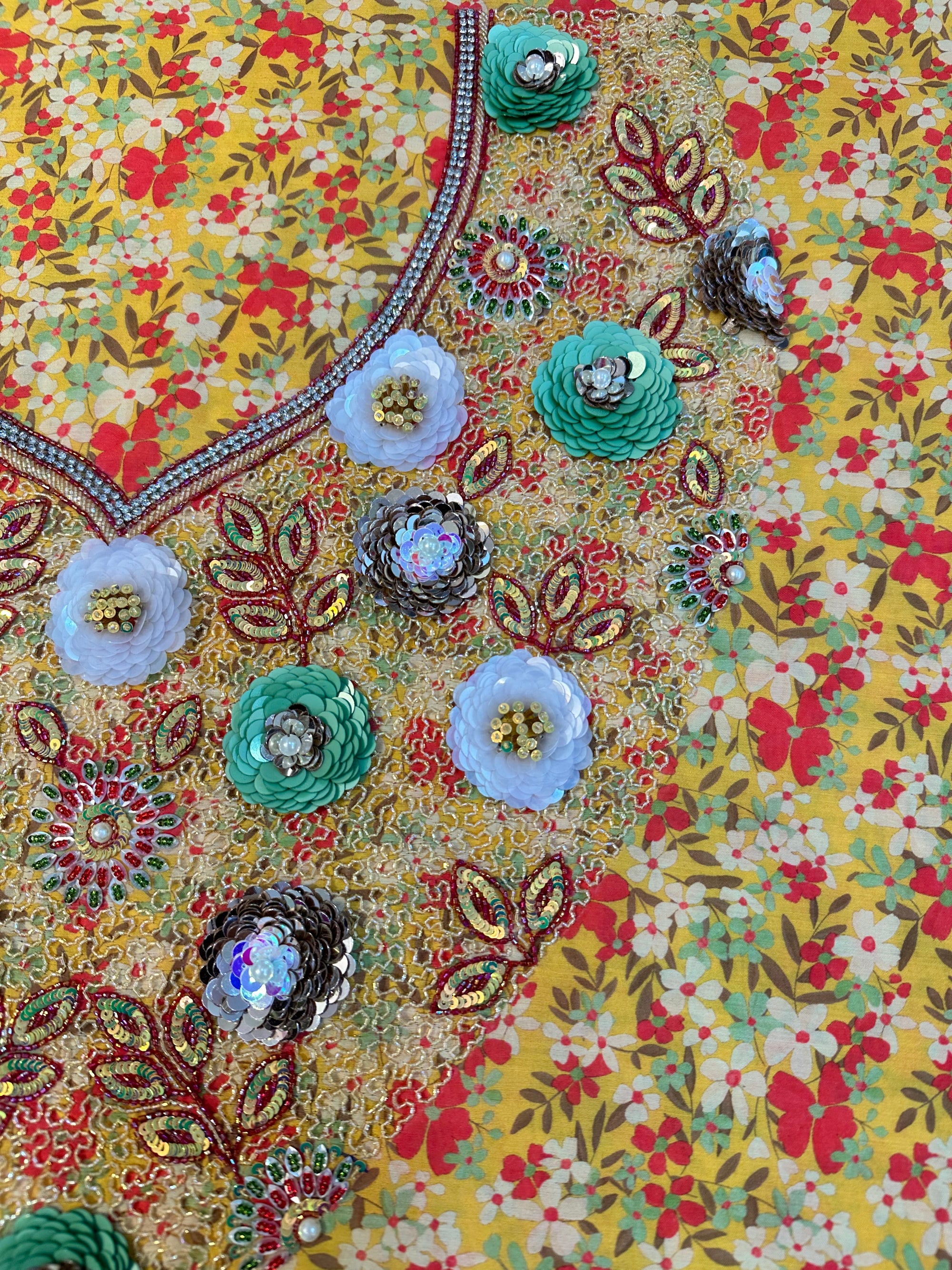 Premium printed cotton fabric displaying the golden wildflower pattern of the Golden Wildflower Cotton Mukhawar for custom tailoring by Gharza Couture.