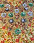 Close-up of the hand-embellished neckline on the Golden Wildflower Cotton Mukhawar showcasing intricate crystal and bead detailing on premium printed cotton fabric.
