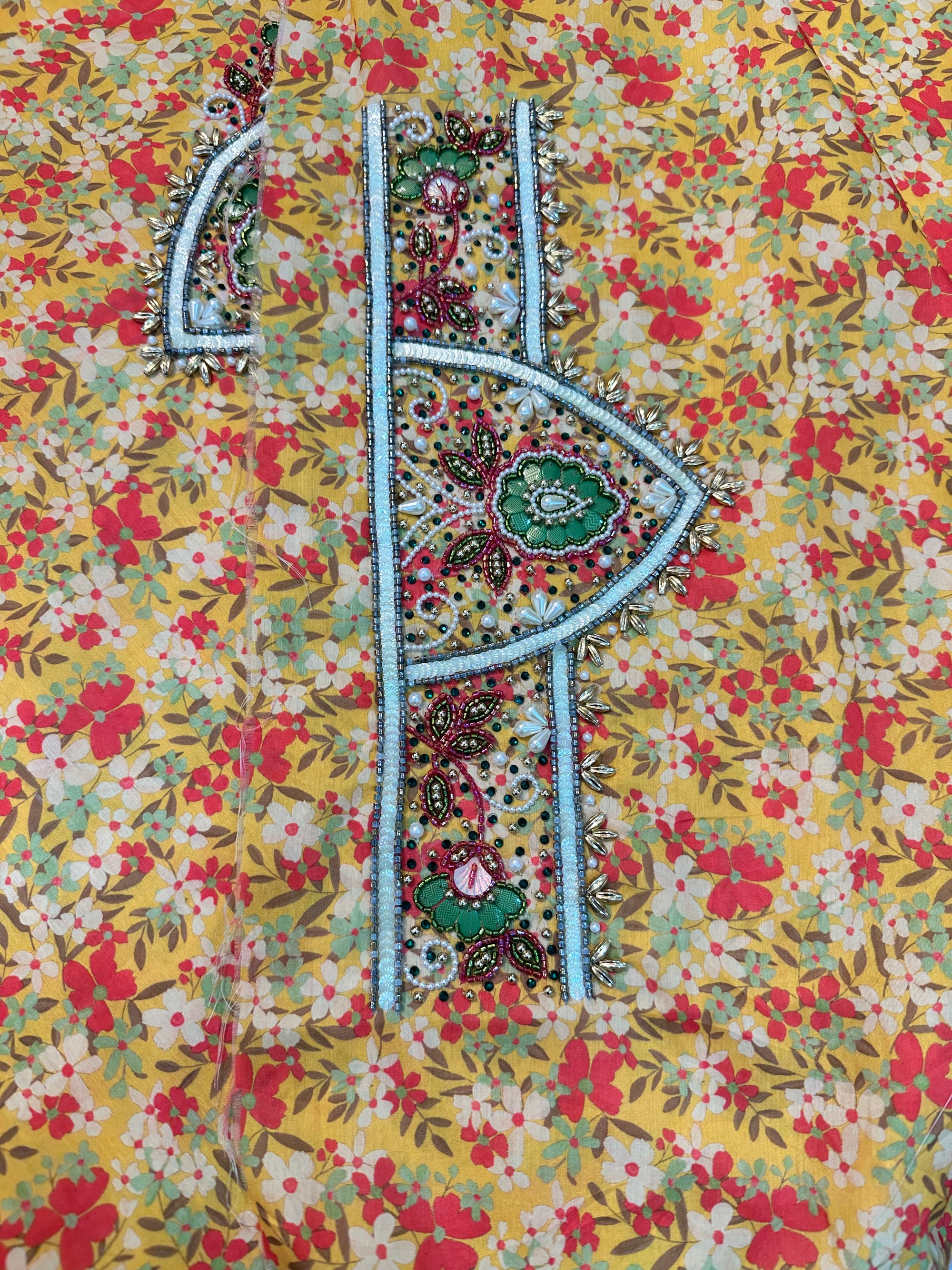 Premium cotton fabric displaying the golden wildflower print of the Golden Wildflower Cotton Mukhawar for custom tailoring by Gharza Couture. 