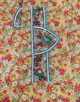 Premium cotton fabric displaying the golden wildflower print of the Golden Wildflower Cotton Mukhawar for custom tailoring by Gharza Couture. 