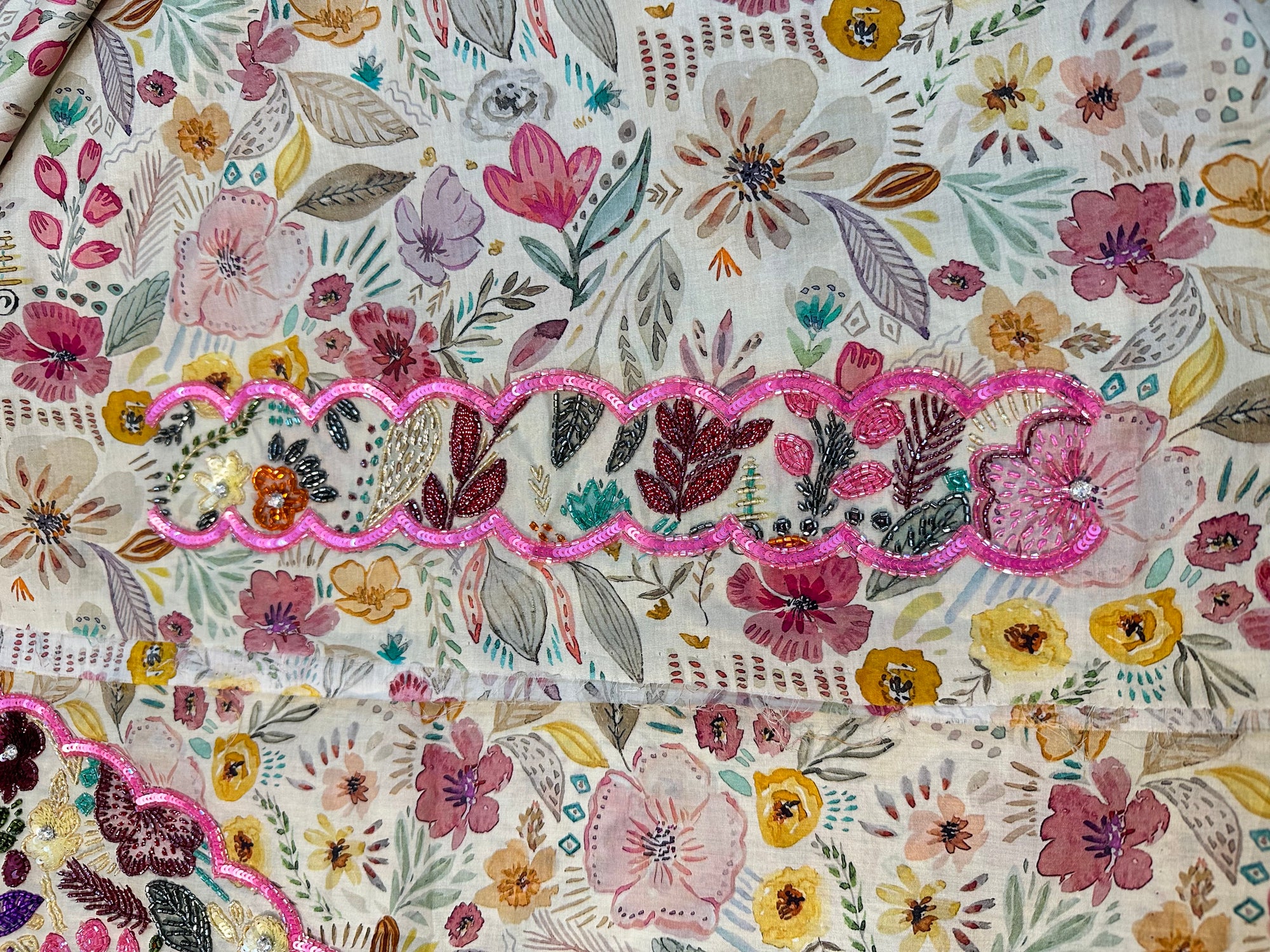 Premium Oriss cotton satin fabric displaying the ivory botanical floral print of the Ivory Botanical Oriss Cotton Satin Mukhawar for custom tailoring by Gharza Couture.