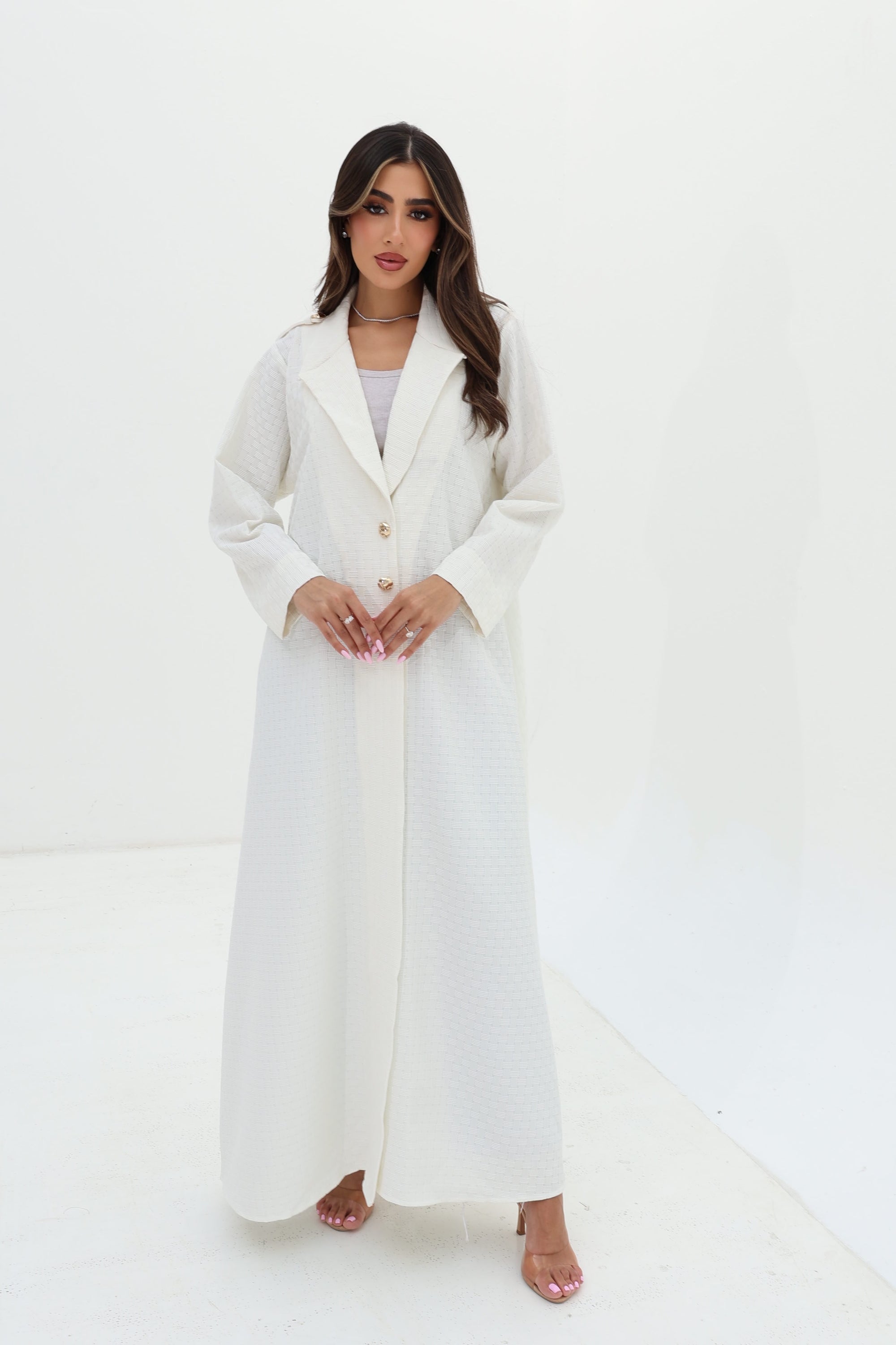 Full-length Ivory White Blazer Textured Stretch Abaya by Gharza Couture with flowing modest silhouette and elegant finish.