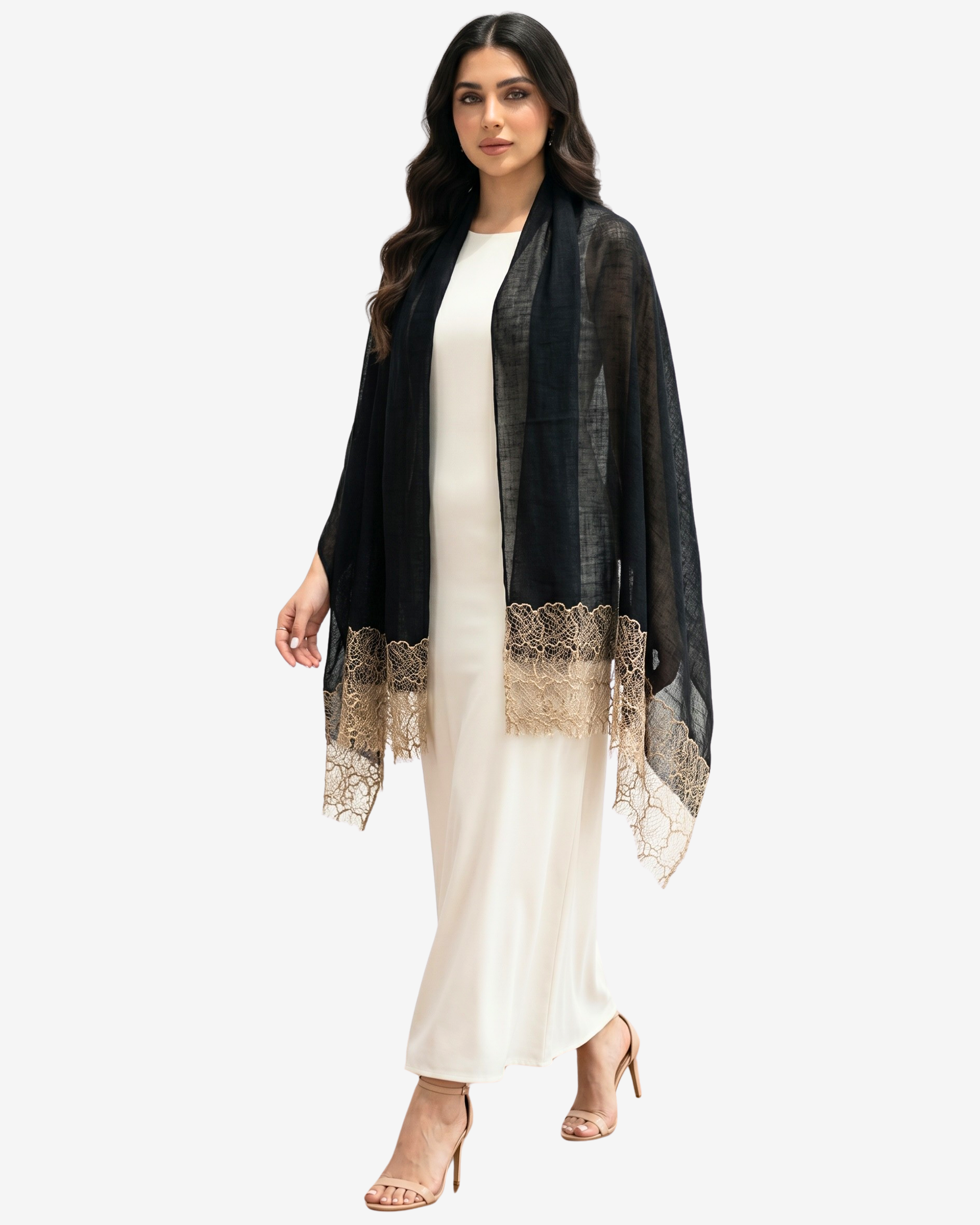A woman modeling a black sheer shawl with beige lace trim over a cream-colored dress, set against a plain light gray background.