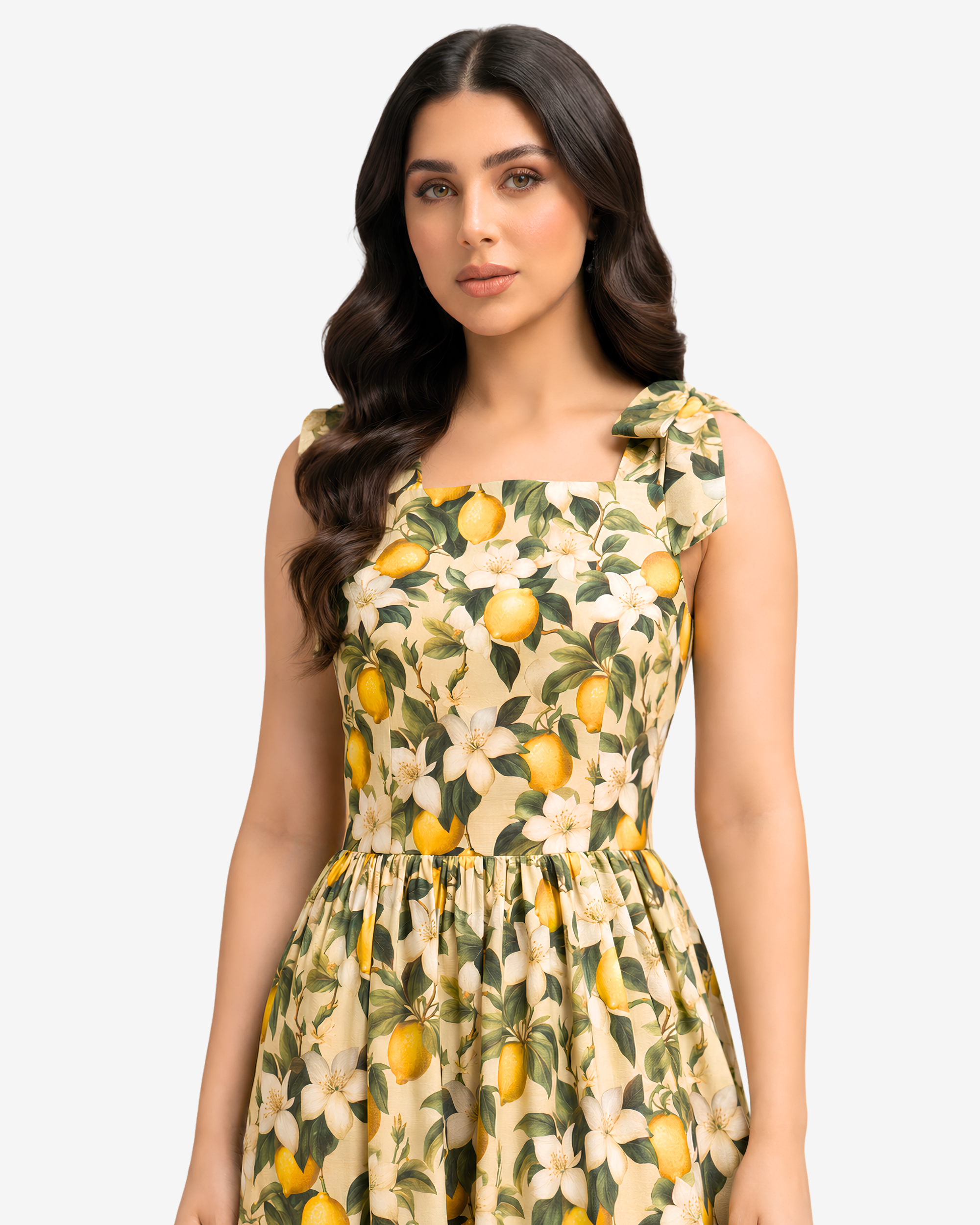 Close-up of the Lemon Blossom Tie Shoulder Linen Blend Dress highlighting the square neckline, tie shoulder straps, and detailed citrus blossom print by Gharza Couture.