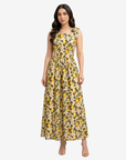 Lemon Blossom Tie Shoulder Linen Blend Dress by Gharza Couture featuring a vibrant citrus floral print, square neckline, and flowing sleeveless maxi silhouette.