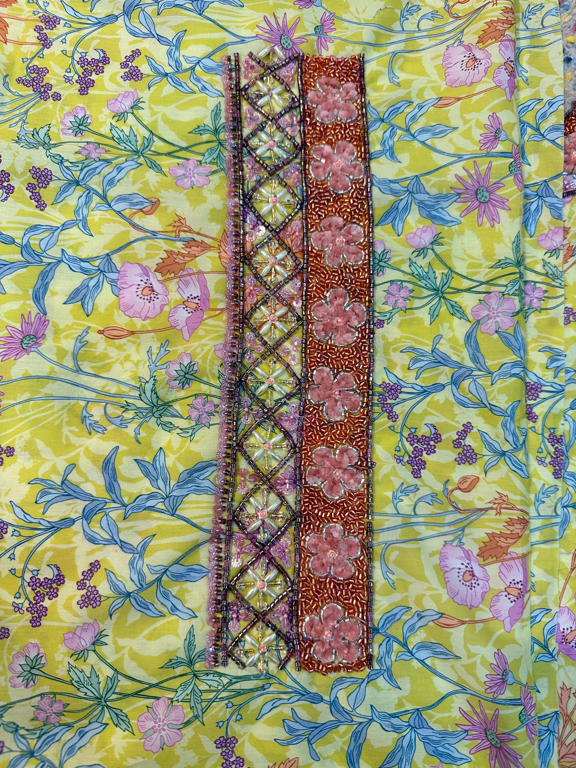 Premium Liberty cotton fabric displaying the vibrant lime floral print of the Lime Liberty Cotton Mukhawar for custom tailoring by Gharza Couture.