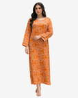 Three-quarter view of Monarch Link orange geometric print modest jalabiya