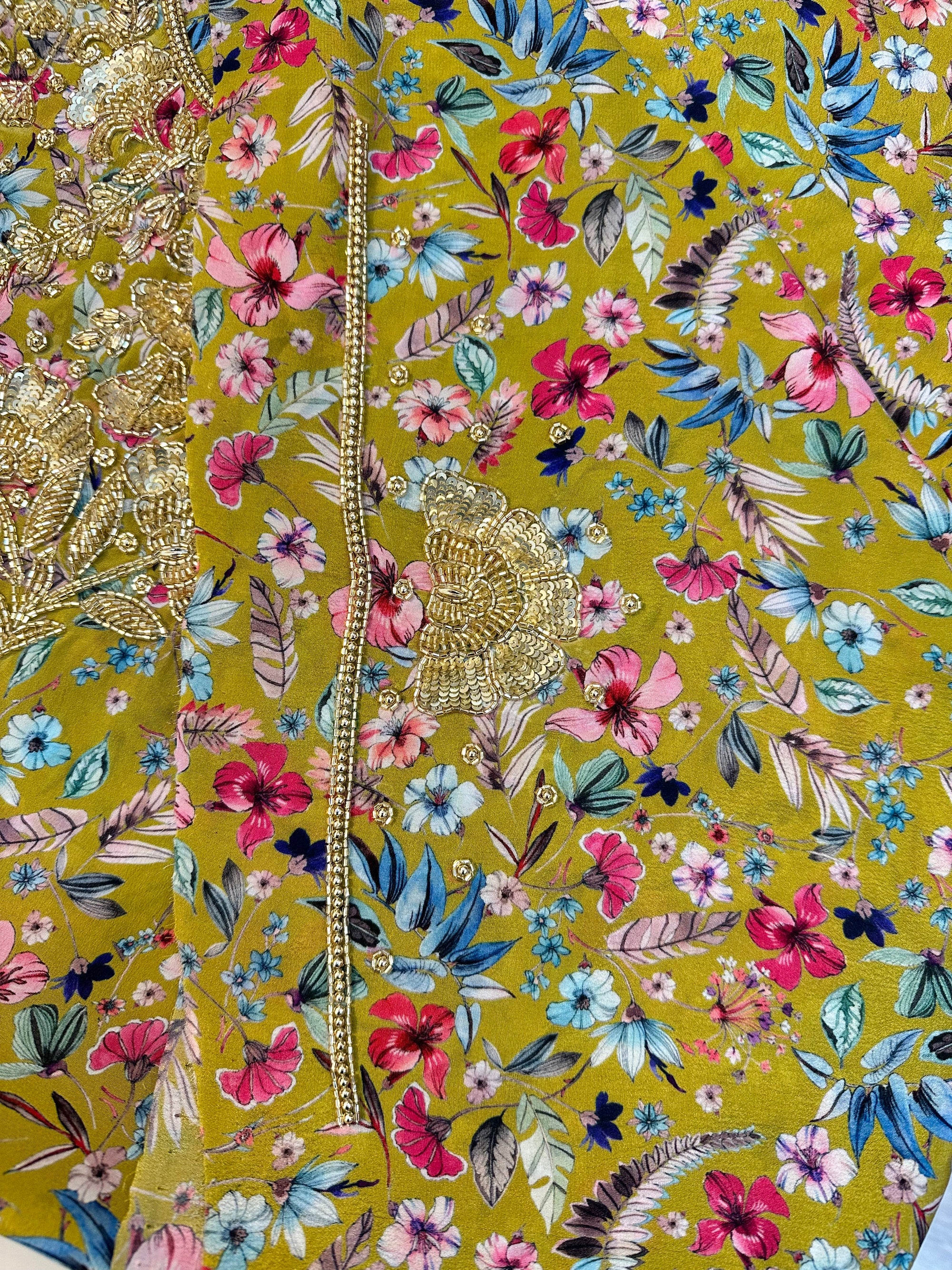 Close-up of the hand-embellished front on the Mustard Wildflower Crepe Mukhawar showcasing intricate crystal and bead detailing on premium crepe fabric.