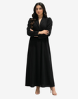 Close-up of the Noir Elegance Tailored Crepe Abaya featuring a structured shawl collar, premium crepe fabric and refined minimalist design.
