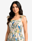 Close-up of the Orchard Aviary Tie Shoulder Linen Blend Dress highlighting the square neckline, adjustable tie shoulder straps, and elegant botanical print.