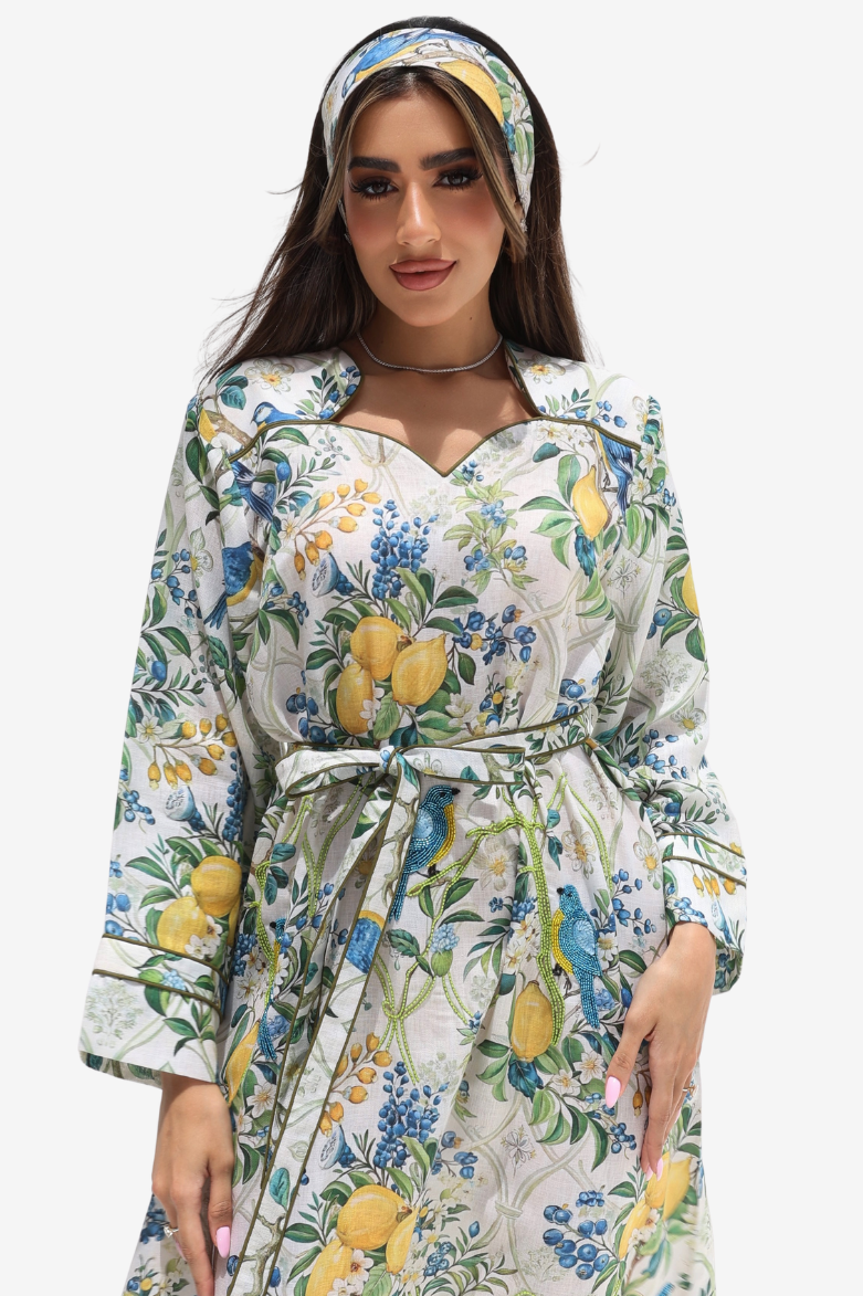 Orchard Aviary Sweetheart Linen Blend Dress close-up showcasing the sweetheart neckline and botanical print