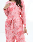 Close-up of the Palm Blush Linen Blend Co-Ord Set showcasing the button-front top, round neckline and palm print by Gharza Couture.