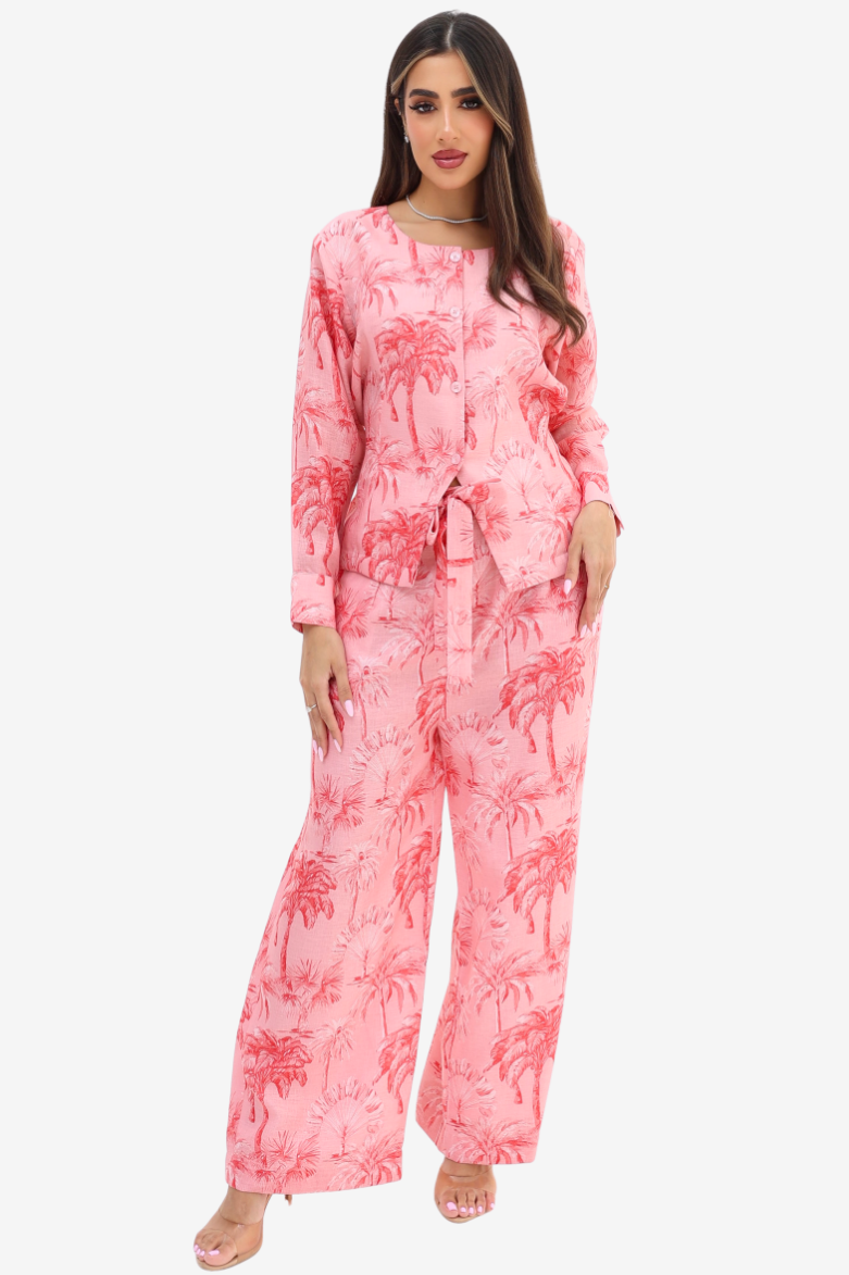 Front view of the Palm Blush Linen Blend Co-Ord Set by Gharza Couture featuring a button-front top, elastic waist wide-leg trousers and palm print.