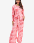 Front view of the Palm Blush Linen Blend Co-Ord Set by Gharza Couture featuring a button-front top, elastic waist wide-leg trousers and palm print.