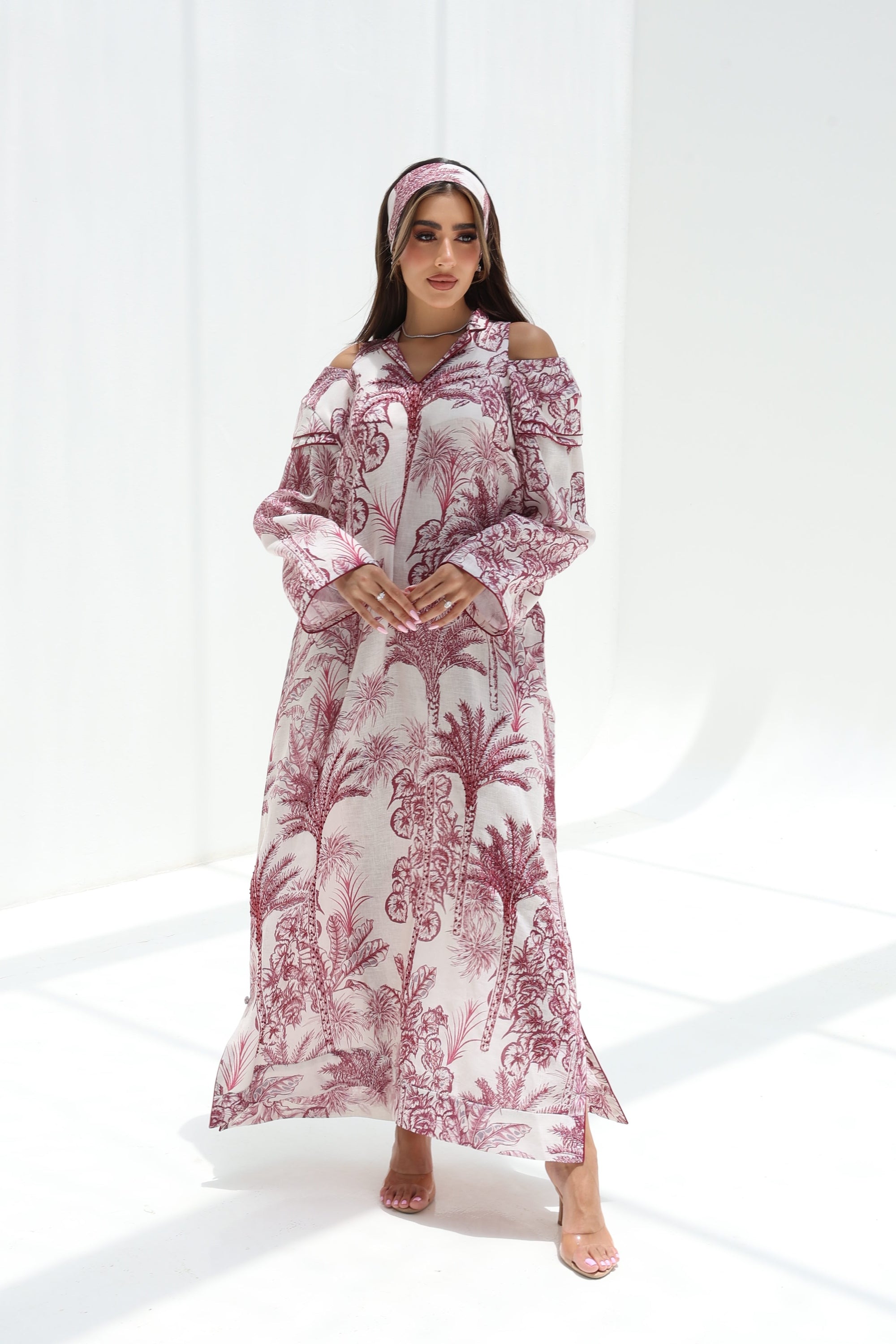 Full-length view of Palm Escape Open Shoulder Linen Blend Jalabiya in burgundy palm print