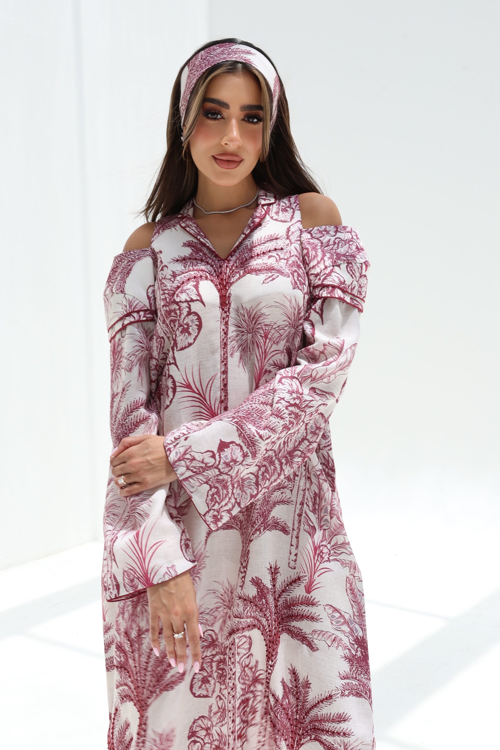 Upper-body view of Palm Escape Open Shoulder Linen Blend Jalabiya in burgundy palm print