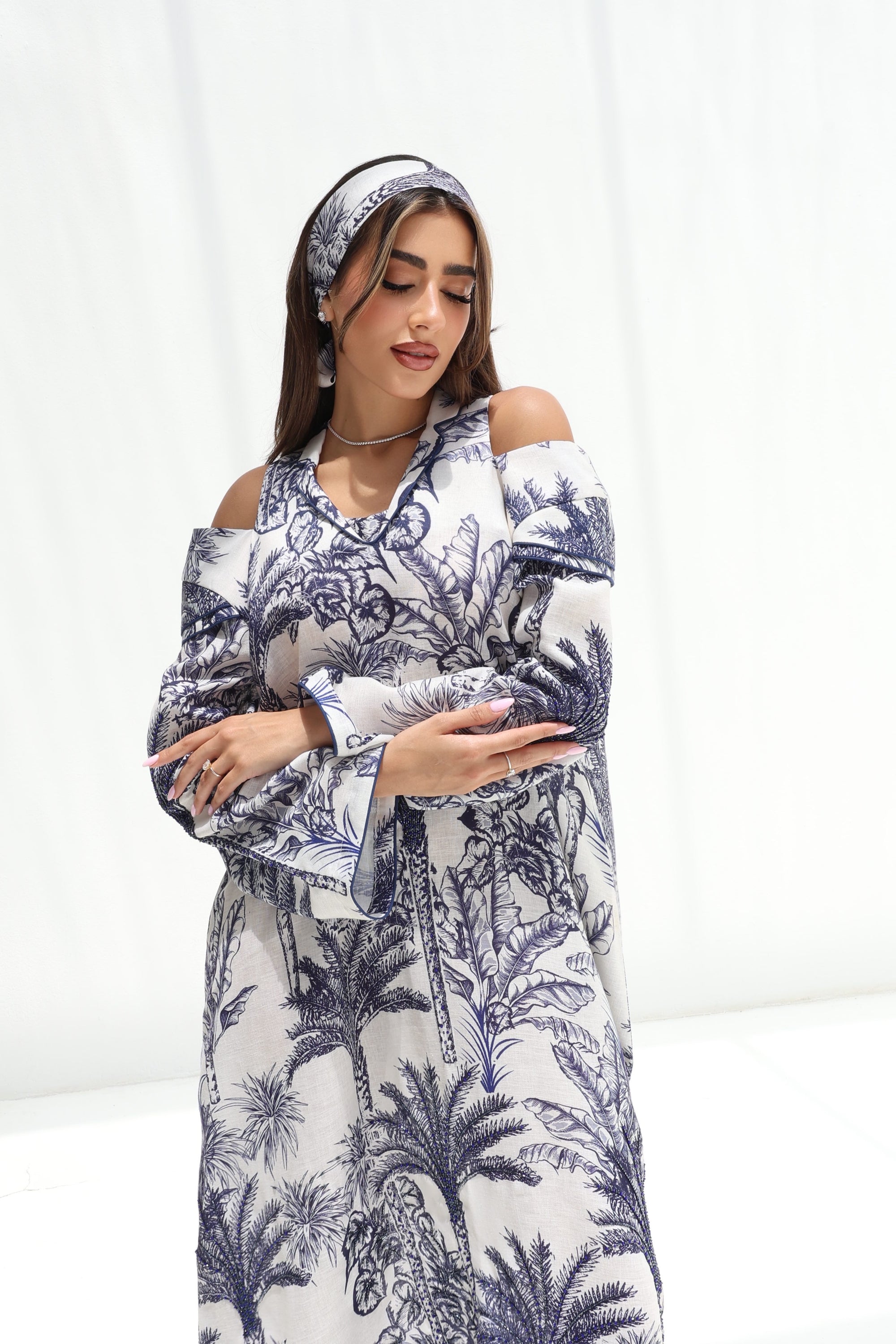 Upper-body view of Palm Escape Open Shoulder Linen Blend Jalabiya in blue palm print