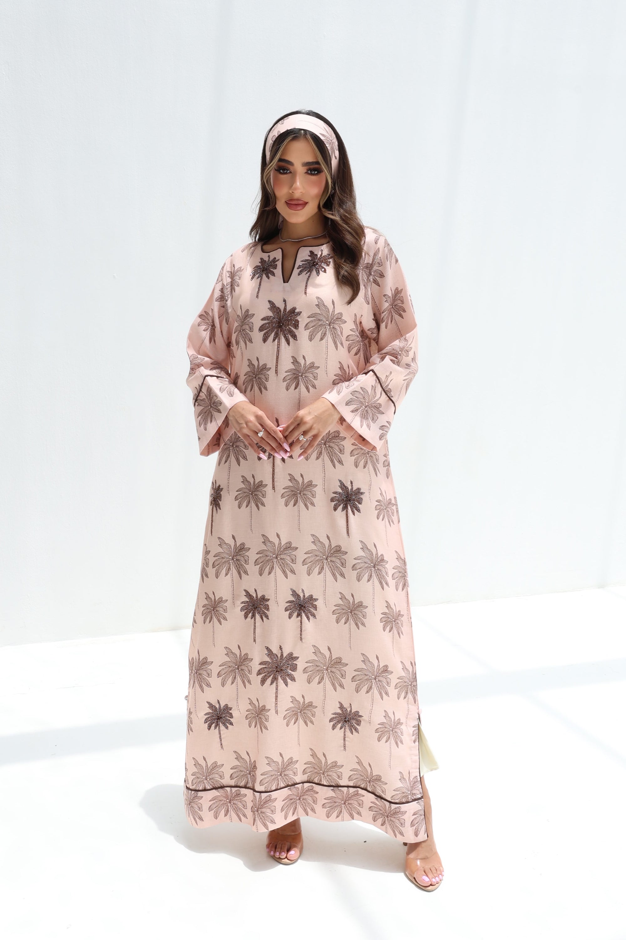 Full-length front view of hand embellished palm print linen blend jalabiya with side slits