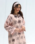 Close three-quarter view of Palm Sketch Highlight Jalabiya showing the embellished neckline and printed sleeves