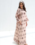 Full-length side view of blush linen blend jalabiya with charcoal palm print and border detailing