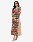 Full-length Paradise Plume linen blend dress featuring vibrant tropical bird print, balloon sleeves and elegant V-neckline.