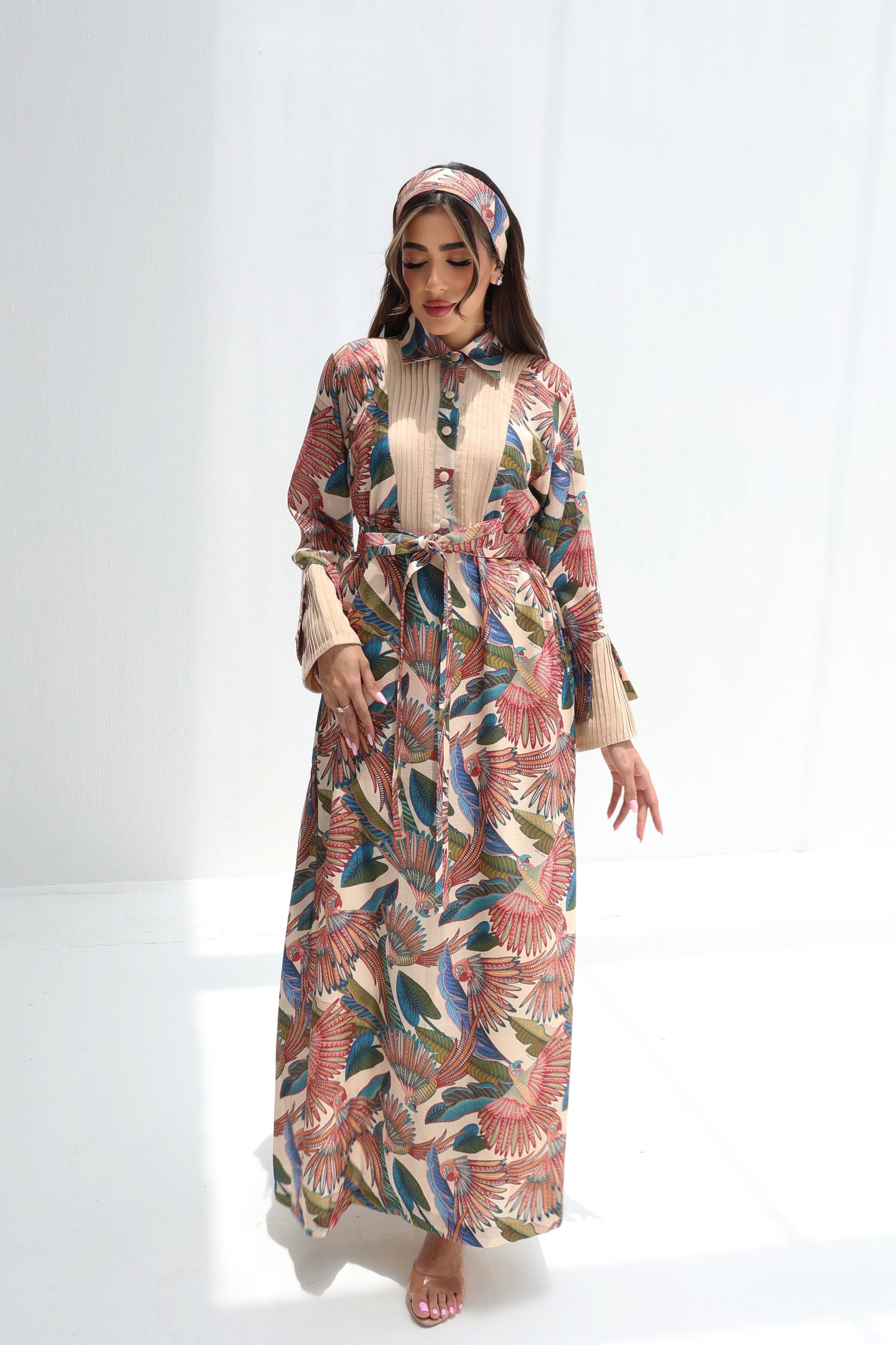 Full-length Paradise Plume linen blend jalabiya featuring a pleated front panel and botanical bird print