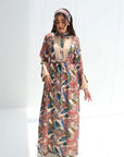 Full-length Paradise Plume linen blend jalabiya featuring a pleated front panel and botanical bird print
