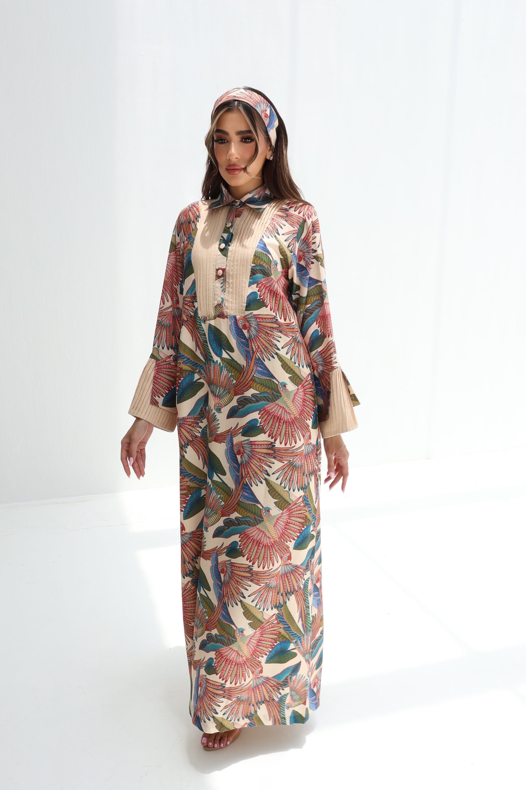 Front view of Paradise Plume luxury linen blend jalabiya with tropical bird and botanical print