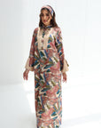 Front view of Paradise Plume luxury linen blend jalabiya with tropical bird and botanical print