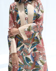 Close-up of the pleated front panel, shirt collar and tropical bird print on the Paradise Plume jalabiya