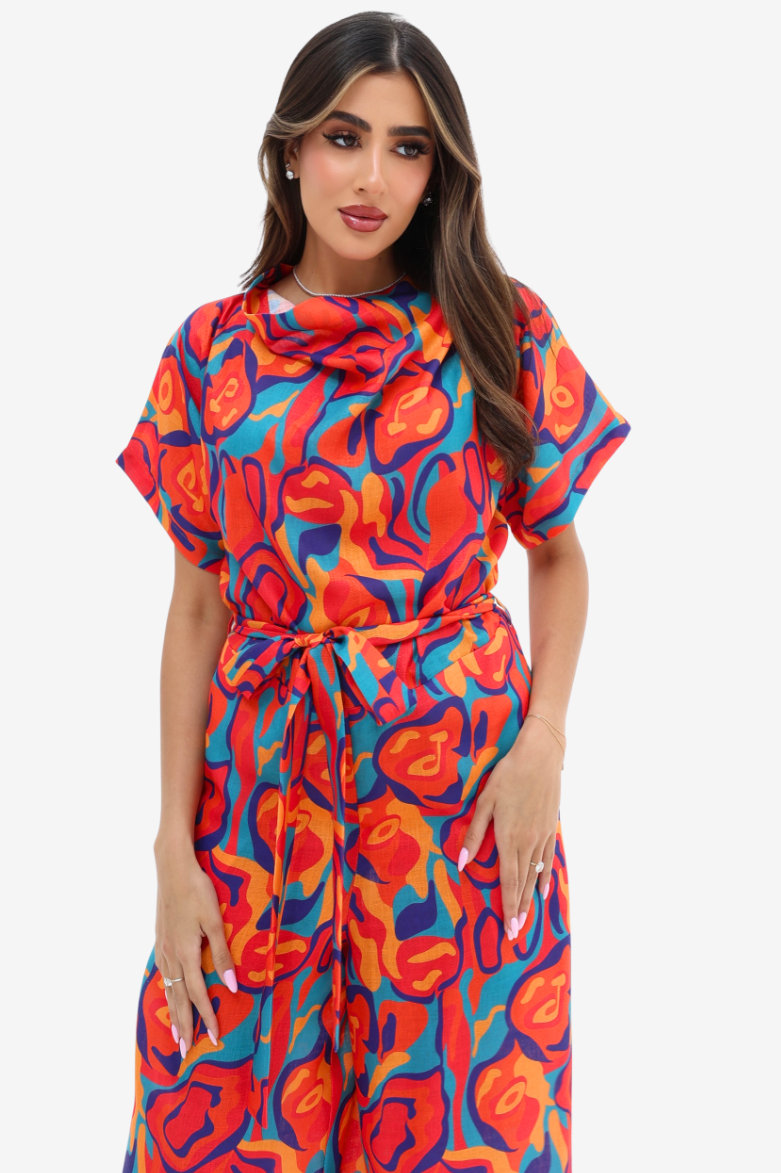 Front view of the Prism Flow Sunset Abstract Linen Blend Jumpsuit with colourful abstract print, soft draped neckline and detachable waist tie.