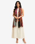 Royal Paisley Cashmere Silk Scarf styled loosely over a white dress with the printed scarf falling at the front