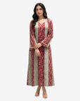Luxury Ruby Tapestry cotton jalabiya with hand embellished V-neckline, floral stripe pattern and flowing modest silhouette by Gharza Couture.