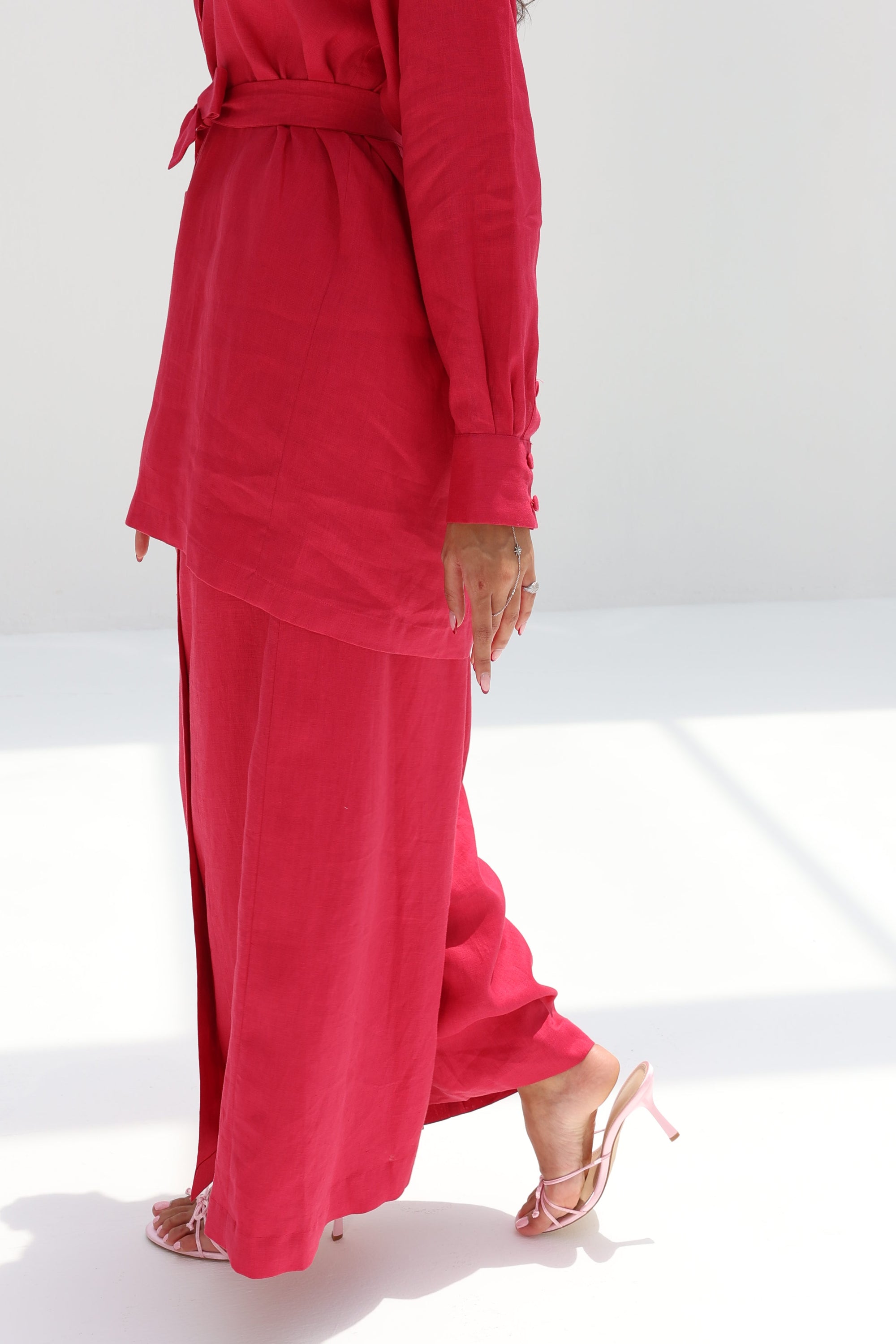 Close-up of the wide-leg linen blend trousers from the Ruby Essence Linen Blend Co-ord Set in ruby red.