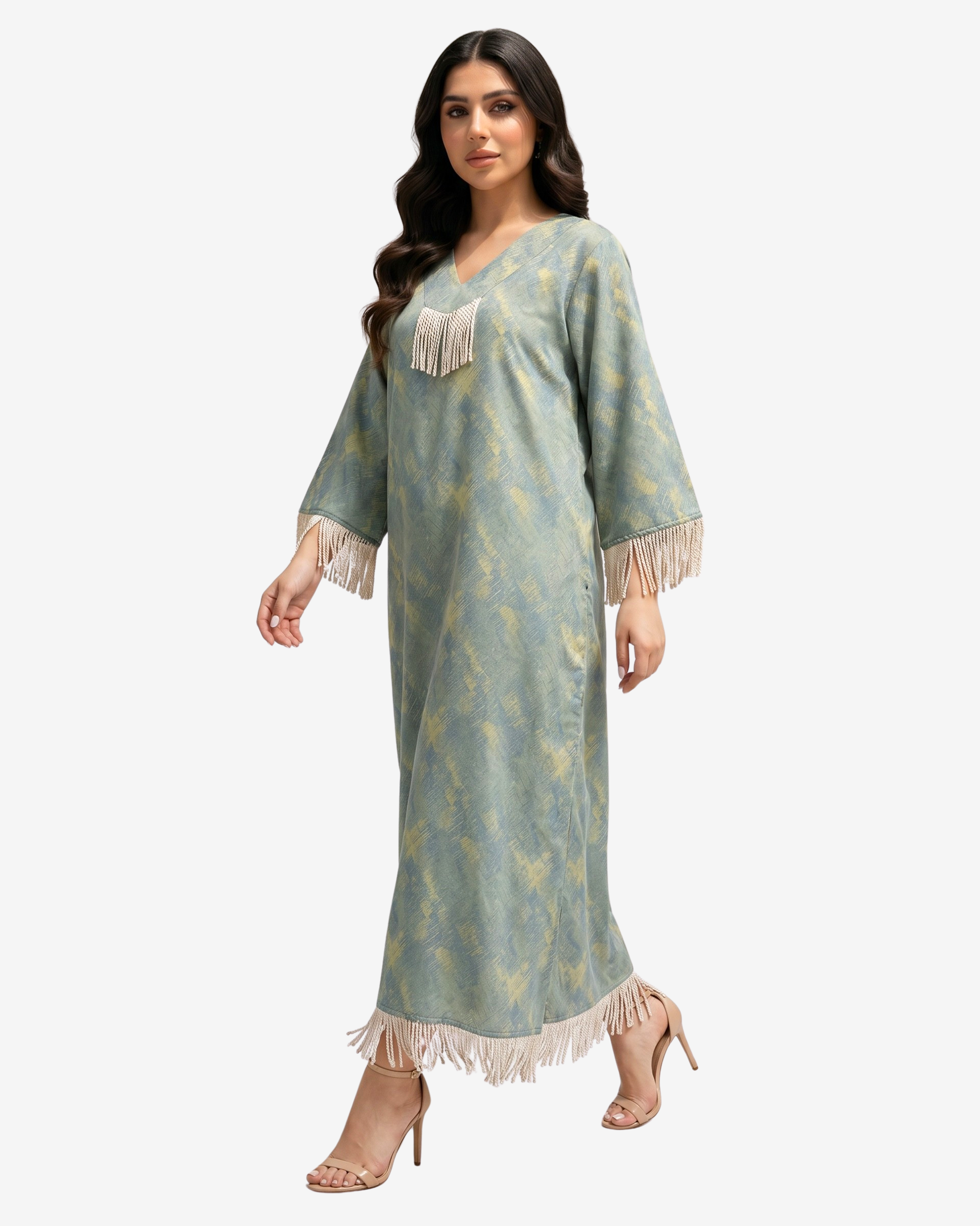 Side walking view of the Sage Mirage Fringe Detail Linen Blend Jalabiya featuring V-neck and fringe tassels.