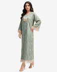Full-length Sage Mirage Linen Blend Jalabiya with fringe sleeves and hem by Gharza Couture.