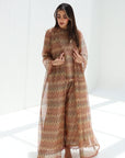 Three-quarter view of sand-toned three-piece set with a long lace outer layer