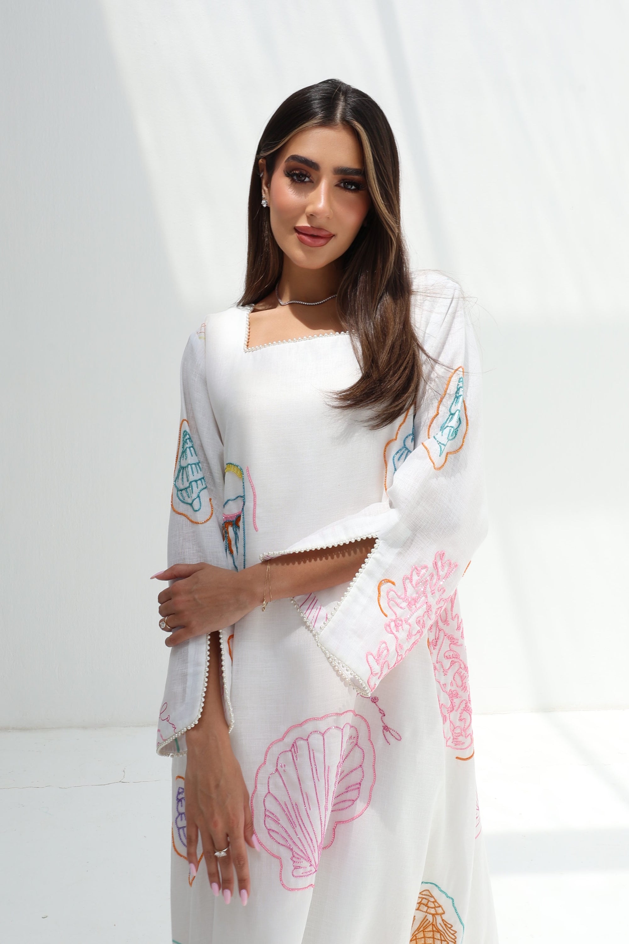 Upper-body view of Seashell Embellished Linen Blend Jalabiya highlighting neckline, sleeves and embellishment details