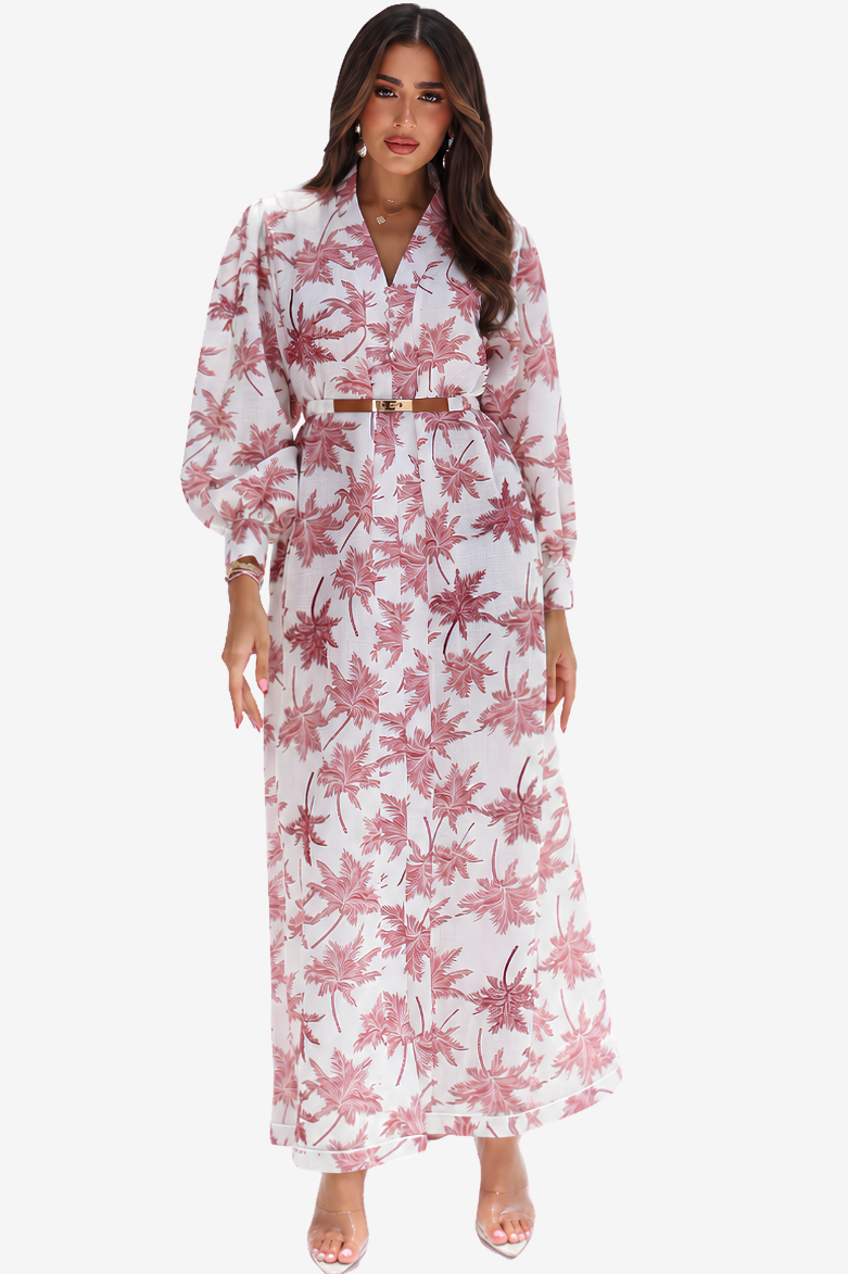 A woman modeling a long-sleeve white maxi dress with a pink floral print and a matching belt, set against a plain light gray background.