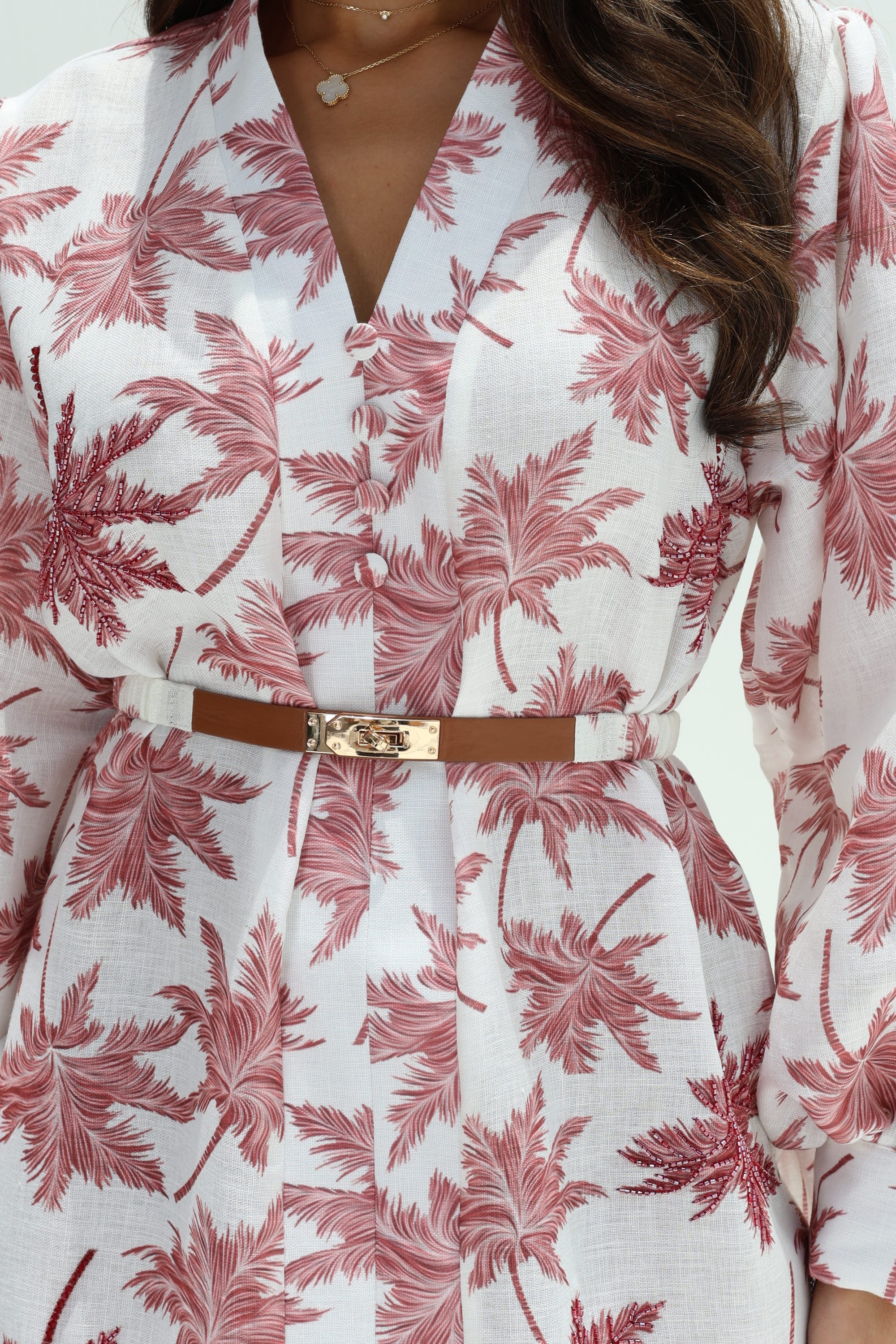 Close-up of white and rose Signature Hand Embellished Dress showing collar and belt detail