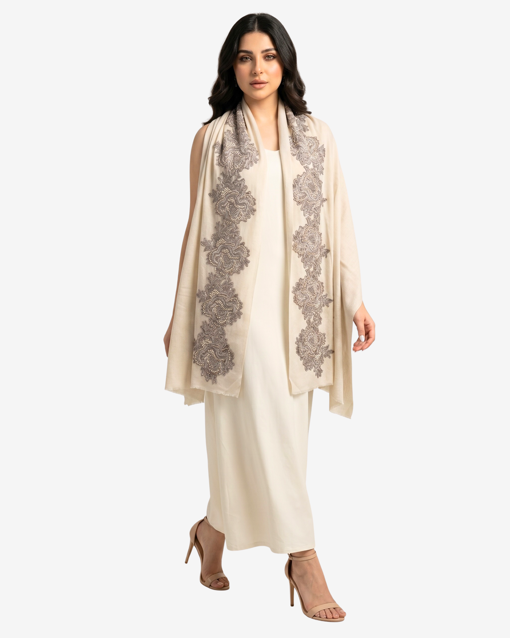 A woman modeling a cream-colored traditional outfit with a matching draped shawl featuring gray floral embroidery, paired with nude high-heeled sandals against a light gray background.