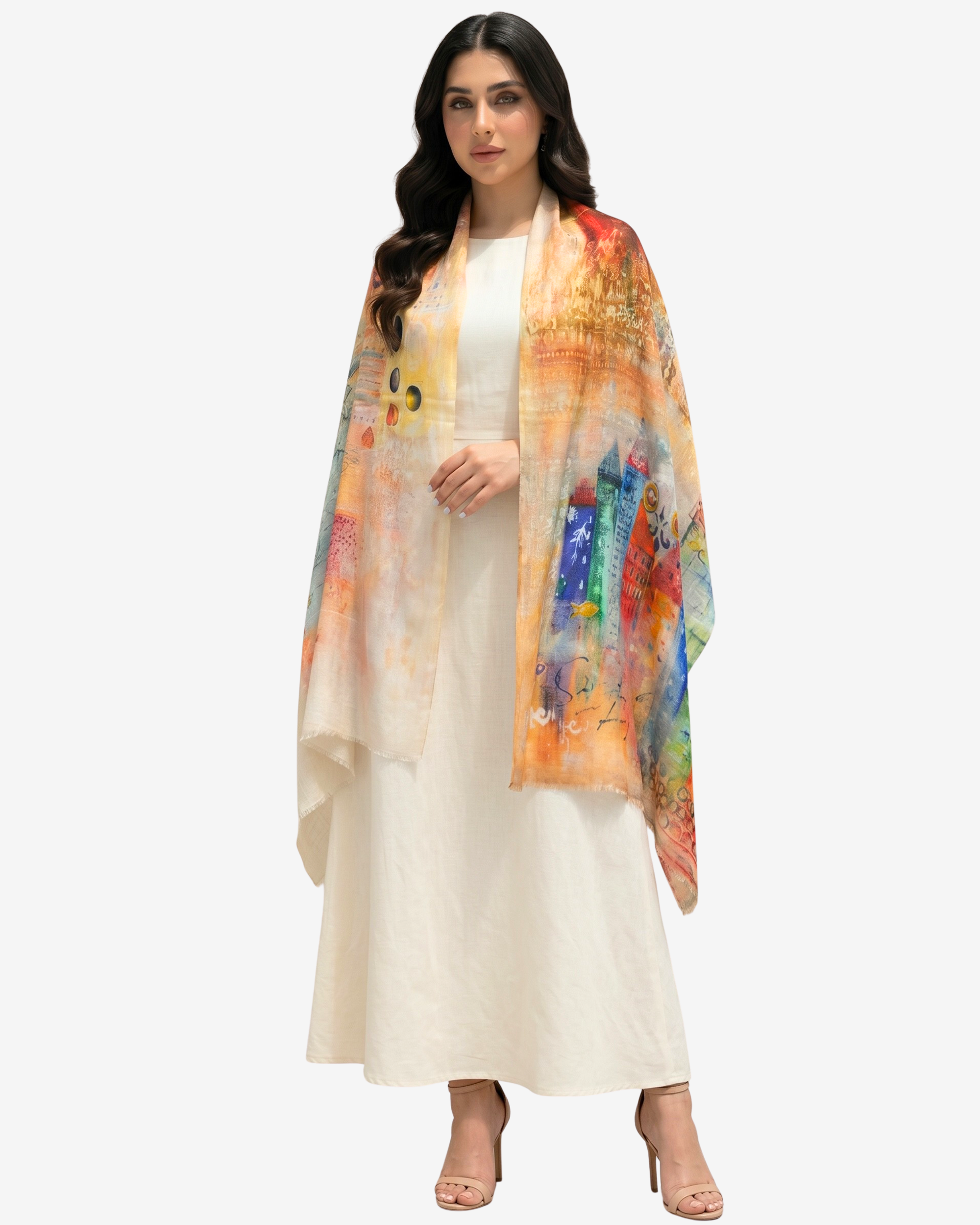A woman modeling a cream-colored dress with a vibrant, multicolored abstract painterly shawl draped over her shoulders, set against a plain light gray background.